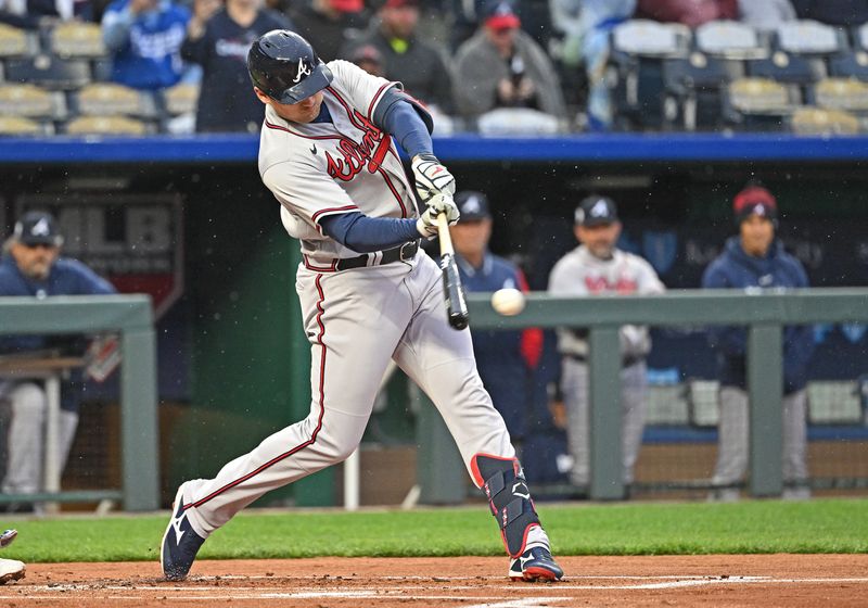 Apr 15, 2023; Kansas City, Missouri, USA;  Atlanta Braves third baseman Austin Riley (27) singles during the first inning against the Kansas City Royals at Kauffman Stadium. Mandatory Credit: Peter Aiken-USA TODAY Sports