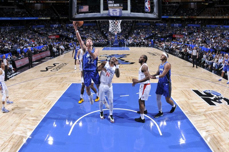 ORLANDO, FL - MARCH 29: Franz Wagner #22 of the Orlando Magic drives to the basket during the game against the LA Clippers on March 29, 2024 at the Kia Center in Orlando, Florida. NOTE TO USER: User expressly acknowledges and agrees that, by downloading and or using this photograph, User is consenting to the terms and conditions of the Getty Images License Agreement. Mandatory Copyright Notice: Copyright 2024 NBAE (Photo by Fernando Medina/NBAE via Getty Images)