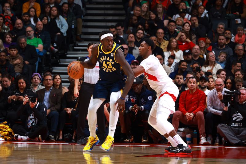 TORONTO, CANADA - NOVEMBER 18: Pascal Siakam #43 of the Indiana Pacers and RJ Barrett #9 of the Toronto Raptors look on during the game on November 18, 2024 at the Scotiabank Arena in Toronto, Ontario, Canada.  NOTE TO USER: User expressly acknowledges and agrees that, by downloading and or using this Photograph, user is consenting to the terms and conditions of the Getty Images License Agreement.  Mandatory Copyright Notice: Copyright 2024 NBAE (Photo by Vaughn Ridley/NBAE via Getty Images)