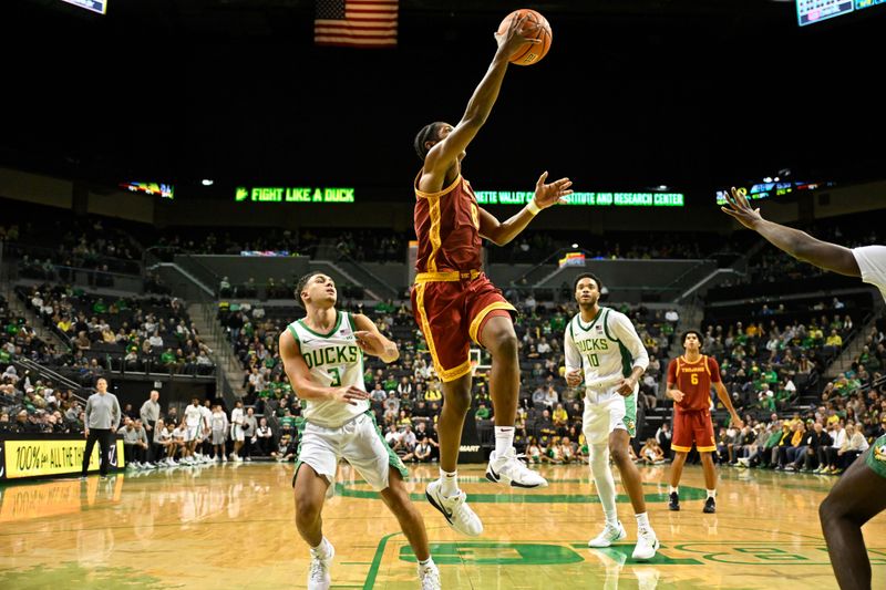 Dec 2, 2025; Eugene, Oregon, USA; Southern California Trojans guard Jerry Easter II (8) drives to the basket past Oregon Ducks guard Jackson Shelstad (3) during the second half at Matthew Knight Arena. Mandatory Credit: Craig Strobeck-Imagn Images