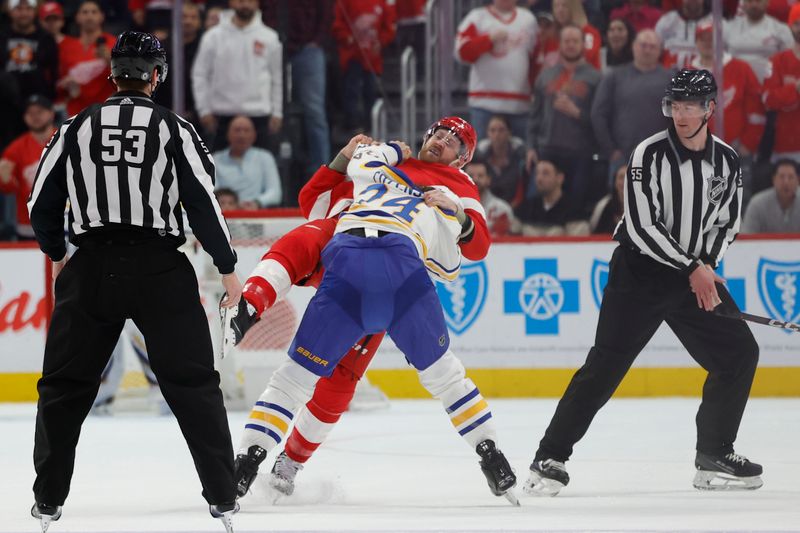 Apr 7, 2024; Detroit, Michigan, USA; Detroit Red Wings defenseman Jeff Petry (46) and Buffalo Sabres center Dylan Cozens (24) fight in the first period at Little Caesars Arena. Mandatory Credit: Rick Osentoski-USA TODAY Sports