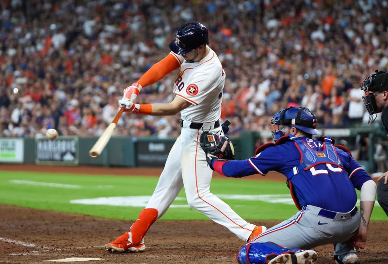 Apr 13, 2024; Houston, Texas, USA;  Houston Astros right fielder Kyle Tucker (30) hits a sacrifice RBI against the Texas Rangers in the seventh inning at Minute Maid Park. Mandatory Credit: Thomas Shea-USA TODAY Sports