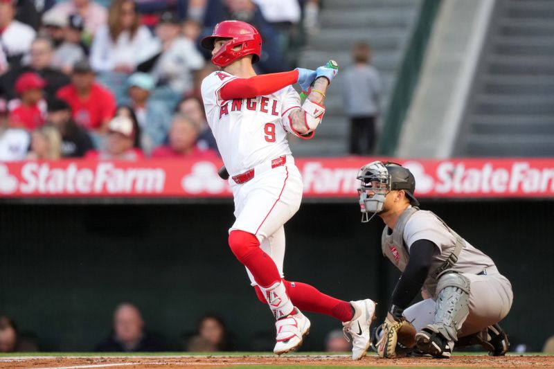 May 28, 2025; Anaheim, California, USA; Los Angeles Angels shortstop Zach Neto (9) hits a single in the first inning against the New York Yankees at Angel Stadium. Mandatory Credit: Kirby Lee-Imagn Images