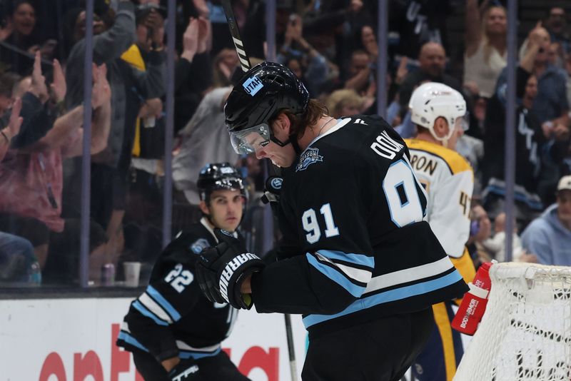 Apr 10, 2025; Salt Lake City, Utah, USA; Utah Hockey Club right wing Josh Doan (91) celebrates scoring a goal against the Nashville Predators during the second period at Delta Center. Mandatory Credit: Rob Gray-Imagn Images