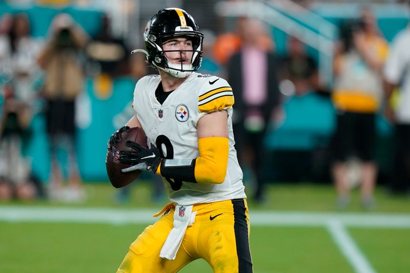 Pittsburgh Steelers quarterback Kenny Pickett (8) aims a pass during the second half of an NFL football game against the Miami Dolphins, Sunday, Oct. 23, 2022, in Miami Gardens, Fla. (AP Photo/Wilfredo Lee )