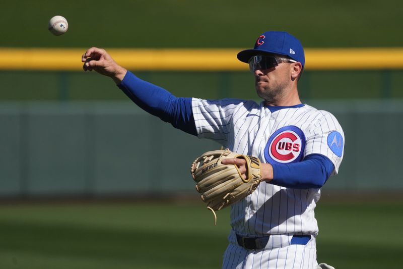 Feb 20, 2026; Mesa, Arizona, USA; Chicago Cubs third baseman Alex Bregman (3) warms up before a game against the Chicago White Sox at Sloan Park. Mandatory Credit: Rick Scuteri-Imagn Images