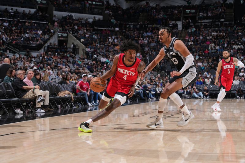 SAN ANTONIO, TX - MARCH 12: Jalen Green #4 of the Houston Rockets dribbles the ball during the game against the San Antonio Spurs on March 12, 2024 at the Frost Bank Center in San Antonio, Texas. NOTE TO USER: User expressly acknowledges and agrees that, by downloading and or using this photograph, user is consenting to the terms and conditions of the Getty Images License Agreement. Mandatory Copyright Notice: Copyright 2024 NBAE (Photos by Jesse D. Garrabrant/NBAE via Getty Images)