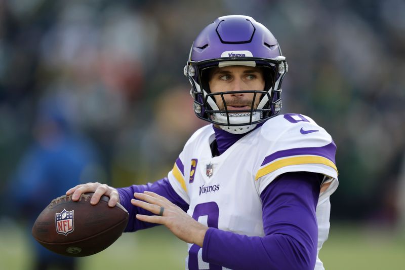 Minnesota Vikings quarterback Kirk Cousins (8) warms up before an NFL football game against the Green Bay Packers, Sunday, Jan. 1, 2023, in Green Bay, Wis. (AP Photo/Matt Ludtke)