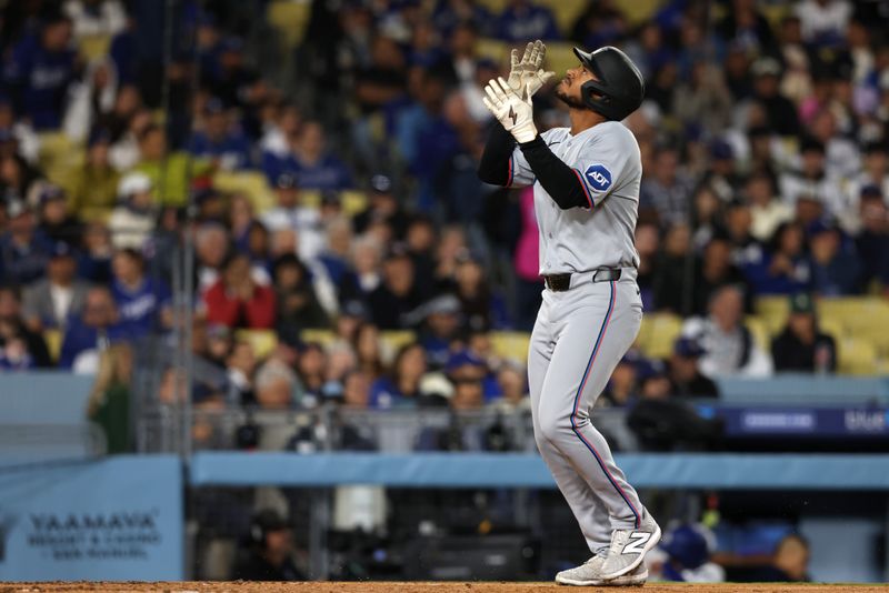 Apr 28, 2025; Los Angeles, California, USA; Miami Marlins outfielder Dane Myers (54) celebrates after hitting a grand slam during the sixth inning against the Los Angeles Dodgers at Dodger Stadium. Mandatory Credit: Jason Parkhurst-Imagn Images