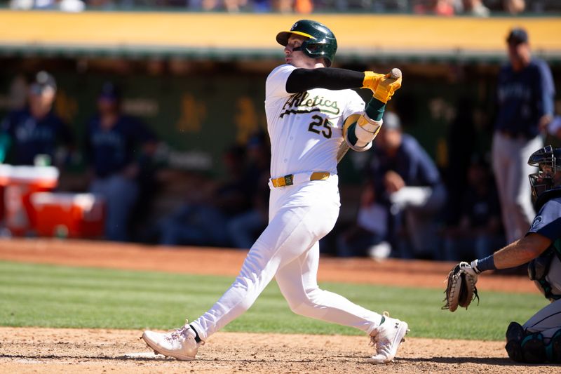 Sep 5, 2024; Oakland, California, USA; Oakland Athletics designated hitter Brent Rooker (25) hits a two-run home run against the Seattle Mariners during the ninth inning at Oakland-Alameda County Coliseum. Mandatory Credit: D. Ross Cameron-Imagn Images