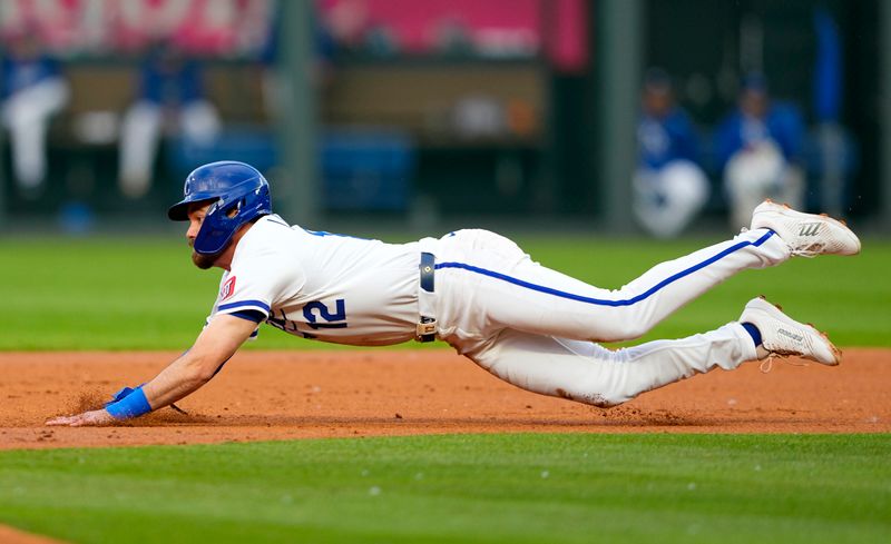 May 28, 2025; Kansas City, Missouri, USA; Kansas City Royals third baseman Nick Loftin (12) steals second base during the second inning against the Cincinnati Reds at Kauffman Stadium. Mandatory Credit: Jay Biggerstaff-Imagn Images
