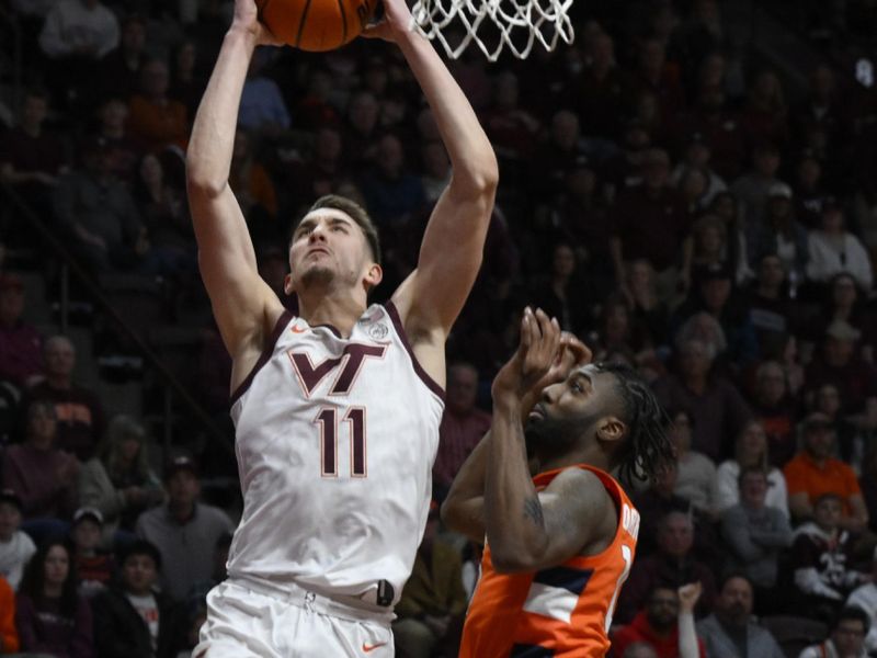 Jan 28, 2023; Blacksburg, Virginia, USA; Virginia Tech Hokies forward John Camden (11) drives to basket against Syracuse Orange guard Symir Torrence (10) in the second half at Cassell Coliseum. Mandatory Credit: Lee Luther Jr.-USA TODAY Sports