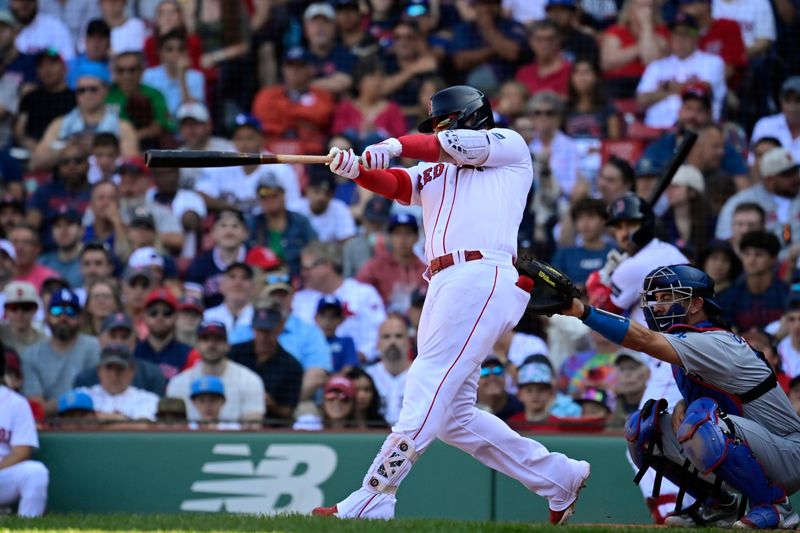 Aug 27, 2023; Boston, Massachusetts, USA; Boston Red Sox designated hitter Justin Turner (2) hits a home run against the Los Angeles Dodgers during the eighth inning at Fenway Park. Mandatory Credit: Eric Canha-USA TODAY Sports