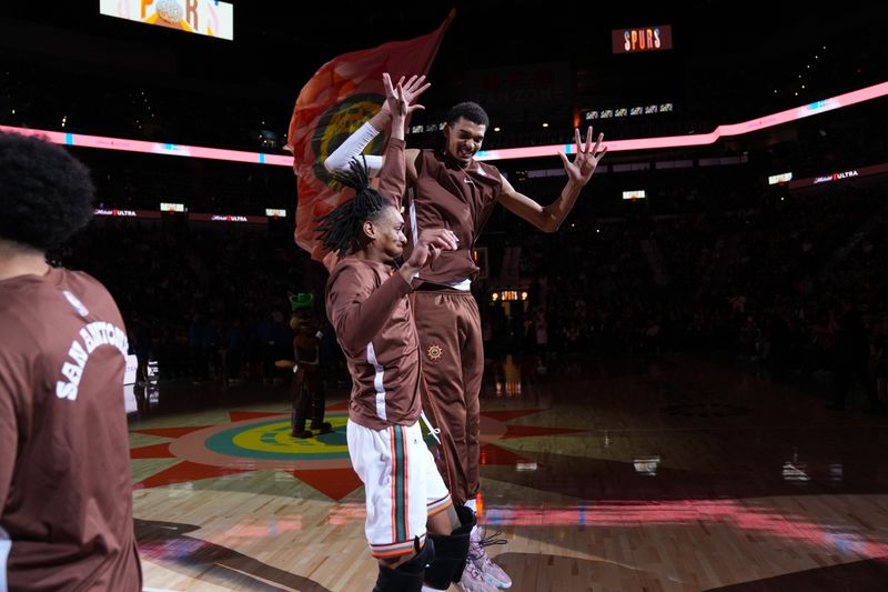 SAN ANTONIO, TX - MARCH 19: Victor Wembanyama #1 of the San Antonio Spurs and Devin Vassell #24 of the San Antonio Spurs celebrate before the game against the Dallas Mavericks on March 19, 2024 at the Frost Bank Center in San Antonio, Texas. NOTE TO USER: User expressly acknowledges and agrees that, by downloading and or using this photograph, user is consenting to the terms and conditions of the Getty Images License Agreement. Mandatory Copyright Notice: Copyright 2024 NBAE (Photos by Darren Carroll/NBAE via Getty Images)