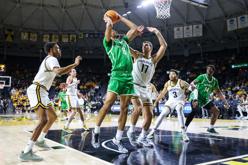 Jan 29, 2025; Wichita, Kansas, USA;  North Texas Mean Green forward Grant Newell (8) shoots the ball over Wichita State Shockers center Matej Bosnjak (17) during the first half at Charles Koch Arena. Mandatory Credit: William Purnell-Imagn Images