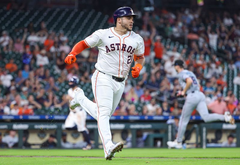 Jul 10, 2024; Houston, Texas, USA; Houston Astros catcher Yainer Diaz (21) runs to first on an RBI single during the first inning against the Miami Marlins at Minute Maid Park. Mandatory Credit: Troy Taormina-USA TODAY Sports