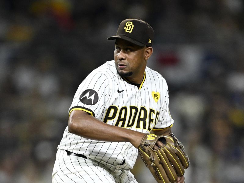 Oct 9, 2024; San Diego, California, USA; San Diego Padres pitcher Wandy Peralta (58) throws in the eighth inning against the Los Angeles Dodgers during game four of the NLDS for the 2024 MLB Playoffs at Petco Park.  Mandatory Credit: Denis Poroy-Imagn Images