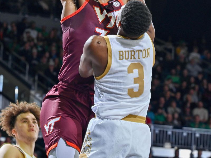 Feb 10, 2024; South Bend, Indiana, USA; Virginia Tech Hokies forward Mylyjael Poteat (34) goes up for a shot as Notre Dame Fighting Irish guard Markus Burton (3) defends in the first half at the Purcell Pavilion. Mandatory Credit: Matt Cashore-USA TODAY Sports