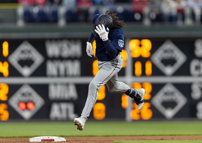 Apr 26, 2023; Philadelphia, Pennsylvania, USA; Seattle Mariners shortstop J.P. Crawford (3) hits a four RBI grand slam during the second inning against the Philadelphia Phillies at Citizens Bank Park. Mandatory Credit: Bill Streicher-USA TODAY Sports