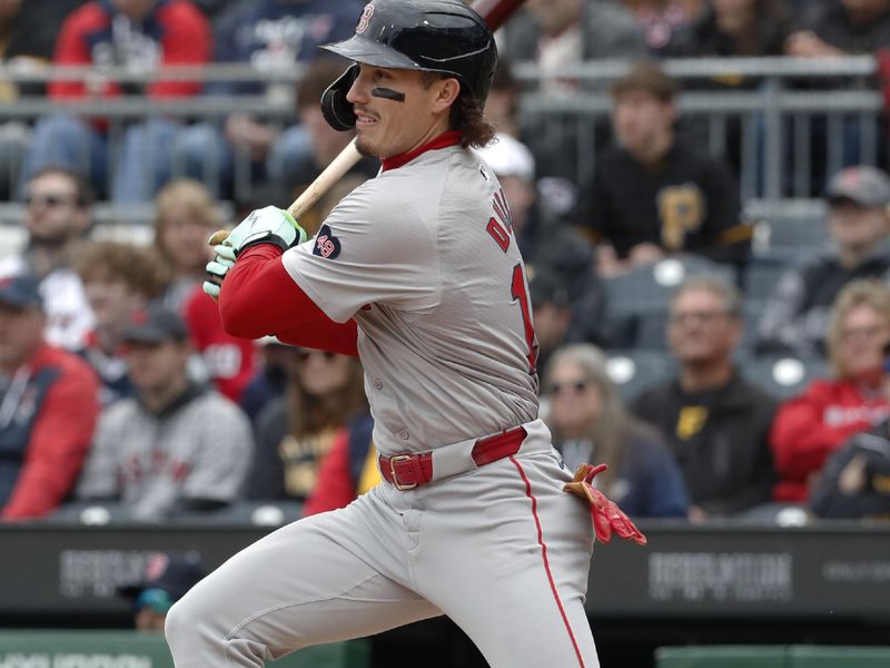 Apr 21, 2024; Pittsburgh, Pennsylvania, USA;  Boston Red Sox center fielder Jarren Duran (16) hits a single against the Pittsburgh Pirates during the third inning at PNC Park. Mandatory Credit: Charles LeClaire-USA TODAY Sports