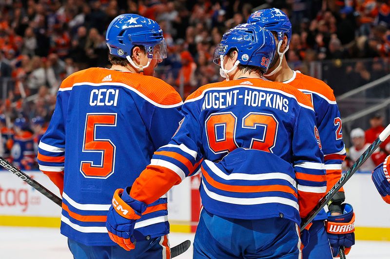 Feb 13, 2024; Edmonton, Alberta, CAN; The Edmonton Oilers celebrate a goal scored by defensemen Cody Ceci (5) during the first period against the Detroit Red Wings at Rogers Place. Mandatory Credit: Perry Nelson-USA TODAY Sports