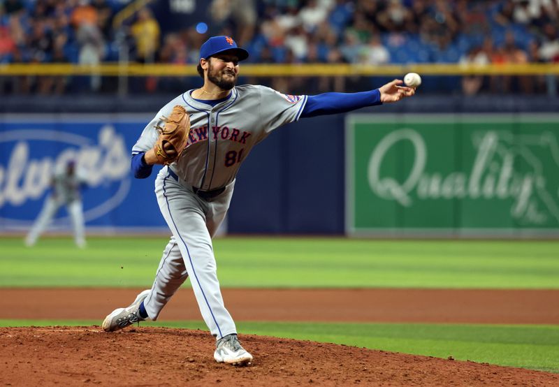 May 3, 2024; St. Petersburg, Florida, USA;  New York Mets pitcher Danny Young (81) throws a pitch against the Tampa Bay Rays during the eighth inning at Tropicana Field. Mandatory Credit: Kim Klement Neitzel-USA TODAY Sports