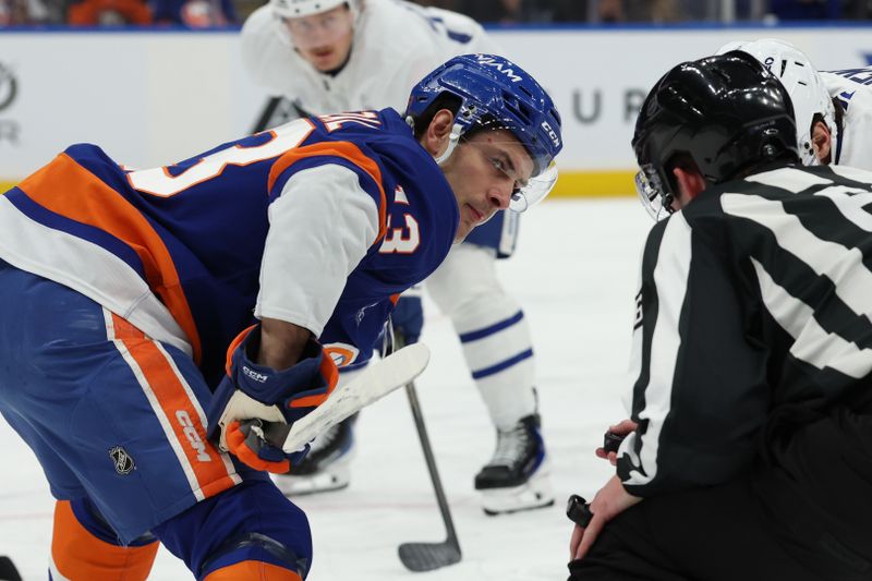 Jan 3, 2026; Elmont, New York, USA;  New York Islanders center Mathew Barzal (13) waits of the puck to drop during a faceoff against the Toronto Maple Leafs during the first period at UBS Arena. Mandatory Credit: Thomas Salus-Imagn Images