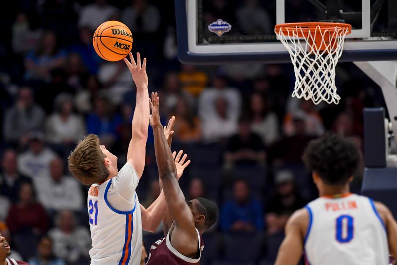 Mar 16, 2024; Nashville, TN, USA;  Texas A&M Aggies forward Henry Coleman III (15) blocks the shot of Florida Gators forward Alex Condon (21) during the first half at Bridgestone Arena. Mandatory Credit: Steve Roberts-USA TODAY Sports