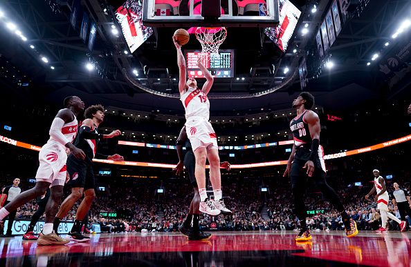 TORONTO, ON - OCTOBER 30: Jakob Poeltl #19 of the Toronto Raptors goes to the basket against the Portland Trail Blazers during the first half of their basketball game at the Scotiabank Arena on October 30, 2023 in Toronto, Ontario, Canada. NOTE TO USER: User expressly acknowledges and agrees that, by downloading and/or using this Photograph, user is consenting to the terms and conditions of the Getty Images License Agreement. (Photo by Mark Blinch/Getty Images)