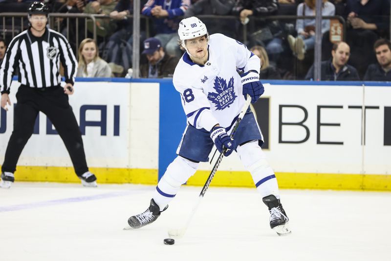 Feb 28, 2025; New York, New York, USA;  Toronto Maple Leafs right wing William Nylander (88) passes the puck in the second period against the New York Rangers at Madison Square Garden. Mandatory Credit: Wendell Cruz-Imagn Images