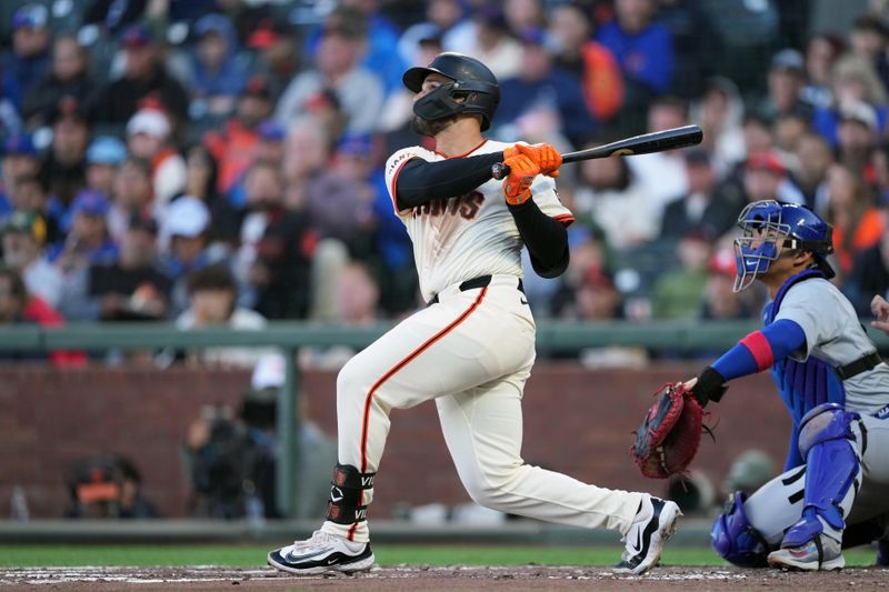 Jun 26, 2024; San Francisco, California, USA; San Francisco Giants first baseman David Villar (32) hits a home run against the Chicago Cubs during the second inning at Oracle Park. Mandatory Credit: Darren Yamashita-USA TODAY Sports