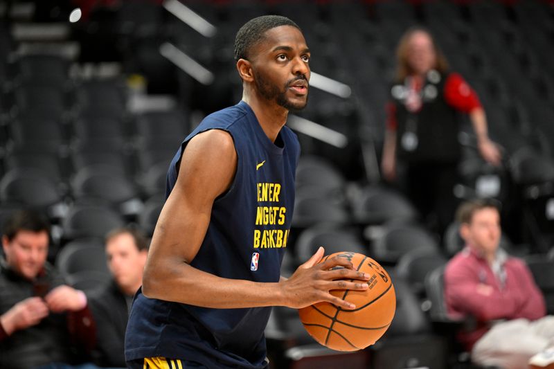 PORTLAND, OREGON - MARCH 23: Justin Holiday #9 of the Denver Nuggets warms up before the game against the Portland Trail Blazers at the Moda Center on March 23, 2024 in Portland, Oregon. NOTE TO USER: User expressly acknowledges and agrees that, by downloading and or using this photograph, User is consenting to the terms and conditions of the Getty Images License Agreement. (Photo by Alika Jenner/Getty Images)