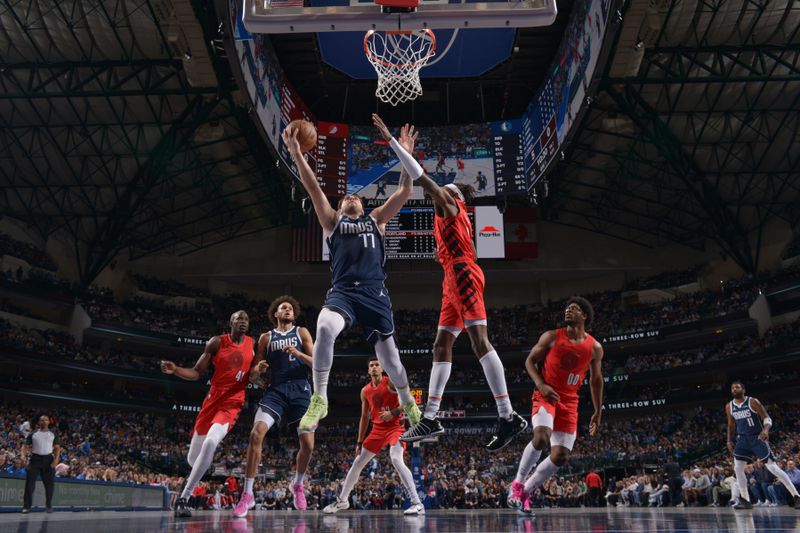 DALLAS, TX - JANUARY 3: Luka Doncic #77 of the Dallas Mavericks drives to the basket during the game against the Portland Trail Blazers on January 3, 2024 at the American Airlines Center in Dallas, Texas. NOTE TO USER: User expressly acknowledges and agrees that, by downloading and or using this photograph, User is consenting to the terms and conditions of the Getty Images License Agreement. Mandatory Copyright Notice: Copyright 2024 NBAE (Photo by Glenn James/NBAE via Getty Images)