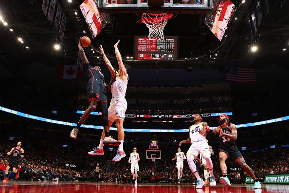 TORONTO, CANADA - DECEMBER 23:  Chris Boucher #25 of the Toronto Raptors drives to the basket during the game against the Utah Jazz on December 23, 2023 at the Scotiabank Arena in Toronto, Ontario, Canada.  NOTE TO USER: User expressly acknowledges and agrees that, by downloading and or using this Photograph, user is consenting to the terms and conditions of the Getty Images License Agreement.  Mandatory Copyright Notice: Copyright 2023 NBAE (Photo by Vaughn Ridley/NBAE via Getty Images)