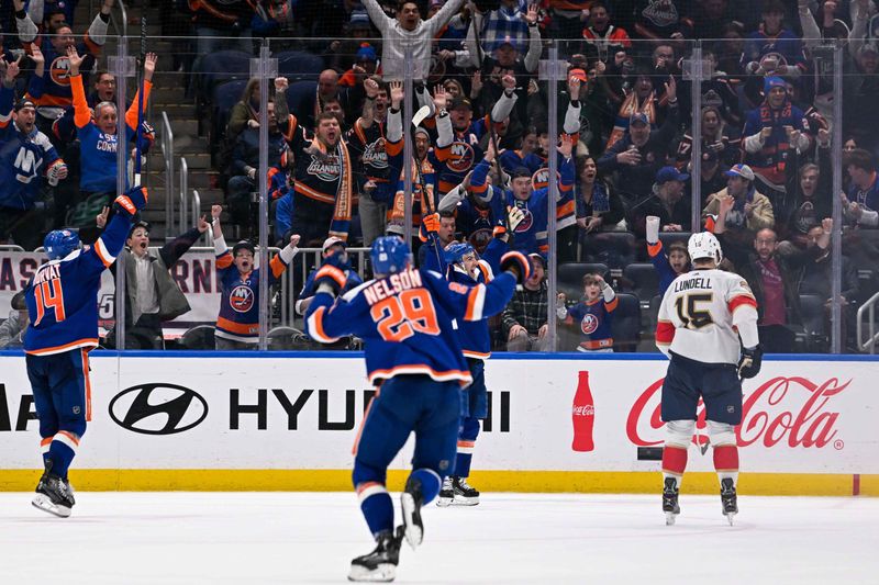 Jan 27, 2024; Elmont, New York, USA; New York Islanders center Kyle Palmieri (21) celebrates his goal against the Florida Panthers during the third period at UBS Arena. Mandatory Credit: Dennis Schneidler-USA TODAY Sports