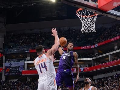 SACRAMENTO, CA - DECEMBER 22:  Malik Monk #0 of the Sacramento Kings goes to the basket during the game on December 22, 2023 at Golden 1 Center in Sacramento, California. NOTE TO USER: User expressly acknowledges and agrees that, by downloading and or using this Photograph, user is consenting to the terms and conditions of the Getty Images License Agreement. Mandatory Copyright Notice: Copyright 2023 NBAE (Photo by Rocky Widner/NBAE via Getty Images)