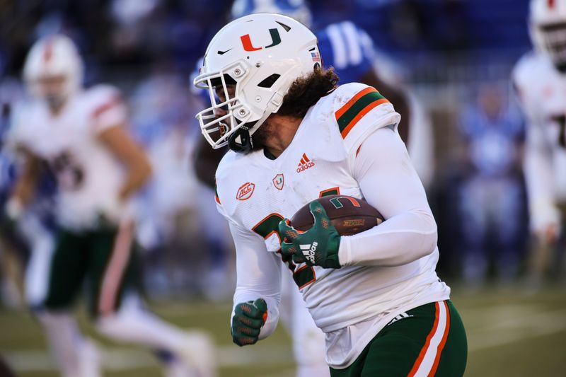 Nov 27, 2021; Durham, North Carolina, USA; Miami Hurricanes running back Cody Brown (24) with the football during the second half of the game against the Miami Hurricanes at Wallace Wade Stadium. at Wallace Wade Stadium. Mandatory Credit: Jaylynn Nash-USA TODAY Sports