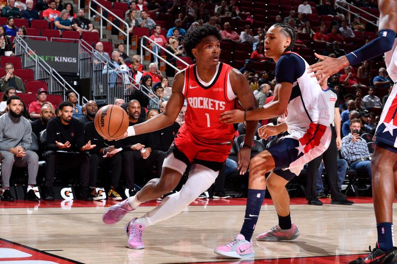 HOUSTON, TX - NOVEMBER 11: Amen Thompson #1 of the Houston Rockets dribbles the ball during the game against the Washington Wizards on November 11, 2024 at the Toyota Center in Houston, Texas. NOTE TO USER: User expressly acknowledges and agrees that, by downloading and or using this photograph, User is consenting to the terms and conditions of the Getty Images License Agreement. Mandatory Copyright Notice: Copyright 2024 NBAE (Photo by Logan Riely/NBAE via Getty Images)