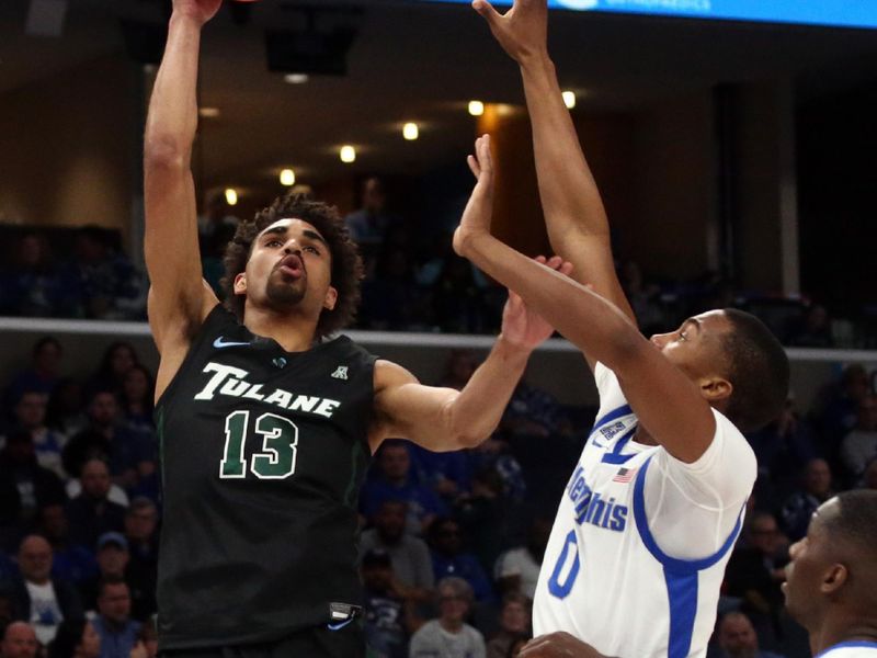 Feb 11, 2024; Memphis, Tennessee, USA; Tulane Green Wave guard Tre' Williams (13) shoots as Memphis Tigers forward Jonathan Pierre (0) defends during the second half at FedExForum. Mandatory Credit: Petre Thomas-USA TODAY Sports