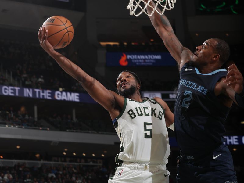 MILWAUKEE, WI - OCTOBER 20: Malik Beasley #5 of the Milwaukee Bucks shoots the ball during the preseason game on October 20, 2023 at the Fiserv Forum Center in Milwaukee, Wisconsin. NOTE TO USER: User expressly acknowledges and agrees that, by downloading and or using this Photograph, user is consenting to the terms and conditions of the Getty Images License Agreement. Mandatory Copyright Notice: Copyright 2023 NBAE (Photo by Gary Dineen/NBAE via Getty Images).