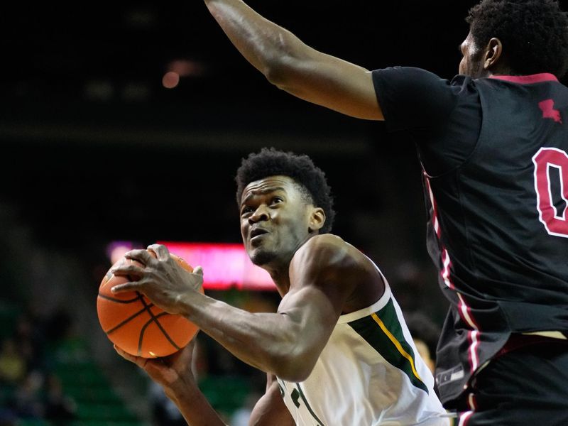 Nov 28, 2023; Waco, Texas, USA; Baylor Bears center Yves Missi (21) looks to shoot against Nicholls State Colonels forward Mekhi Collins (0) during the first half at Ferrell Center. Mandatory Credit: Chris Jones-USA TODAY Sports