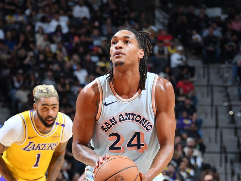 SAN ANTONIO, TX - NOVEMBER 27: Devin Vassell #24 of the San Antonio Spurs shoots a free throw during the game against the Los Angeles Lakers on November 27, 2024 at the Frost Bank Center in San Antonio, Texas. NOTE TO USER: User expressly acknowledges and agrees that, by downloading and or using this photograph, user is consenting to the terms and conditions of the Getty Images License Agreement. Mandatory Copyright Notice: Copyright 2024 NBAE (Photos by Michael Gonzales/NBAE via Getty Images)