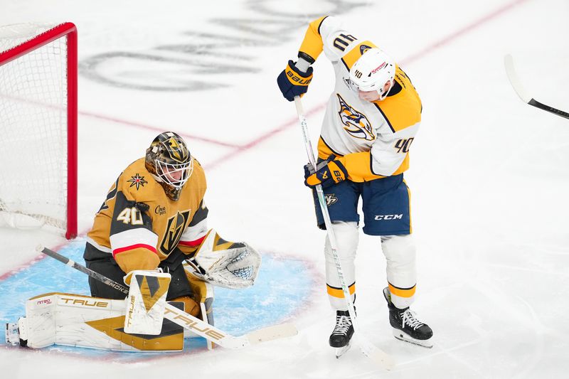 Dec 31, 2025; Las Vegas, Nevada, USA; Vegas Golden Knights goaltender Akira Schmid (40) makes a save off a deflection from Nashville Predators center Fedor Svechkov (40) during the third period at T-Mobile Arena. Mandatory Credit: Stephen R. Sylvanie-Imagn Images