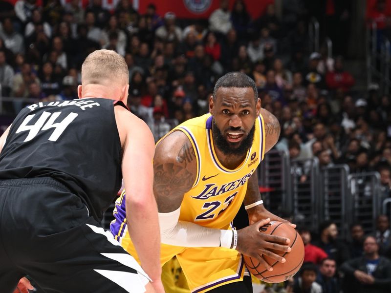 LOS ANGELES, CA - FEBRUARY 28: LeBron James #23 of the Los Angeles Lakers handles the ball during the game against the LA Clippers on February 28, 2024 at Crypto.Com Arena in Los Angeles, California. NOTE TO USER: User expressly acknowledges and agrees that, by downloading and/or using this Photograph, user is consenting to the terms and conditions of the Getty Images License Agreement. Mandatory Copyright Notice: Copyright 2024 NBAE (Photo by Andrew D. Bernstein/NBAE via Getty Images)