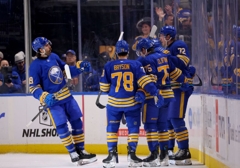 Dec 3, 2024; Buffalo, New York, USA;  Buffalo Sabres center Tage Thompson (72) celebrates his second goal of the game with teammates during the first period against the Colorado Avalanche at KeyBank Center. Mandatory Credit: Timothy T. Ludwig-Imagn Images