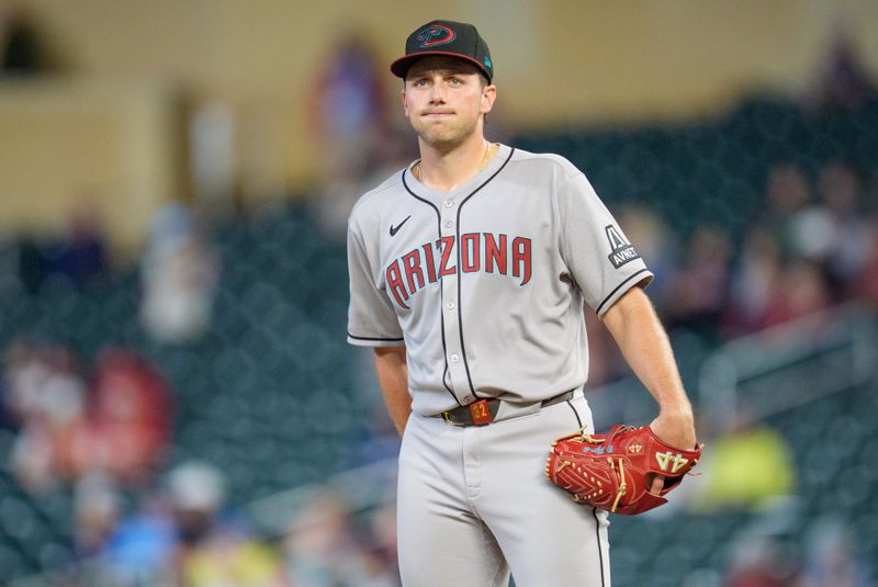 Sep 12, 2025; Minneapolis, Minnesota, USA; Arizona Diamondbacks starting pitcher Brandon Pfaadt (32) regroups after the Minnesota Twins score in the fourth inning at Target Field. Mandatory Credit: Matt Blewett-Imagn Images