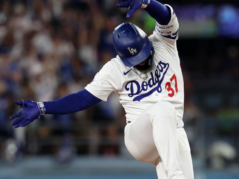 Jul 5, 2024; Los Angeles, California, USA;  Los Angeles Dodgers right fielder Teoscar Hernandez (37) reacts after hitting an RBI double during the eighth inning against the Milwaukee Brewers at Dodger Stadium. Mandatory Credit: Kiyoshi Mio-USA TODAY Sports