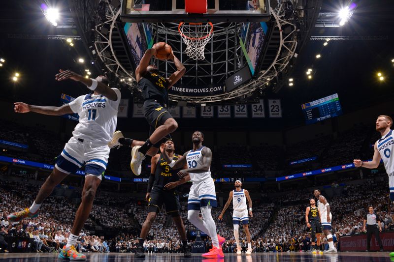 MINNEAPOLIS, MN -  MAY 6: Moses Moody #4 of the Golden State Warriors drives to the basket during the game against the Minnesota Timberwolves during Round 2 Game 1 of the 2025 NBA Playoffs on May 6, 2025 at Target Center in Minneapolis, Minnesota. NOTE TO USER: User expressly acknowledges and agrees that, by downloading and or using this Photograph, user is consenting to the terms and conditions of the Getty Images License Agreement. Mandatory Copyright Notice: Copyright 2025 NBAE (Photo by Jesse D. Garrabrant/NBAE via Getty Images)