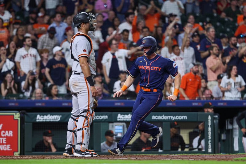 May 1, 2023; Houston, Texas, USA; Houston Astros center fielder Jake Meyers (6) score a run past San Francisco Giants catcher Blake Sabol (2) during the fifth inning at Minute Maid Park. Mandatory Credit: Troy Taormina-USA TODAY Sports