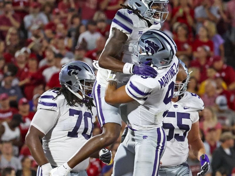 Sep 24, 2022; Norman, Oklahoma, USA;  Kansas State Wildcats wide receiver Malik Knowles (4) celebrates with quarterback Adrian Martinez (9)  after scoring a touchdown during the first half against the Oklahoma Sooners at Gaylord Family-Oklahoma Memorial Stadium. Mandatory Credit: Kevin Jairaj-USA TODAY Sports